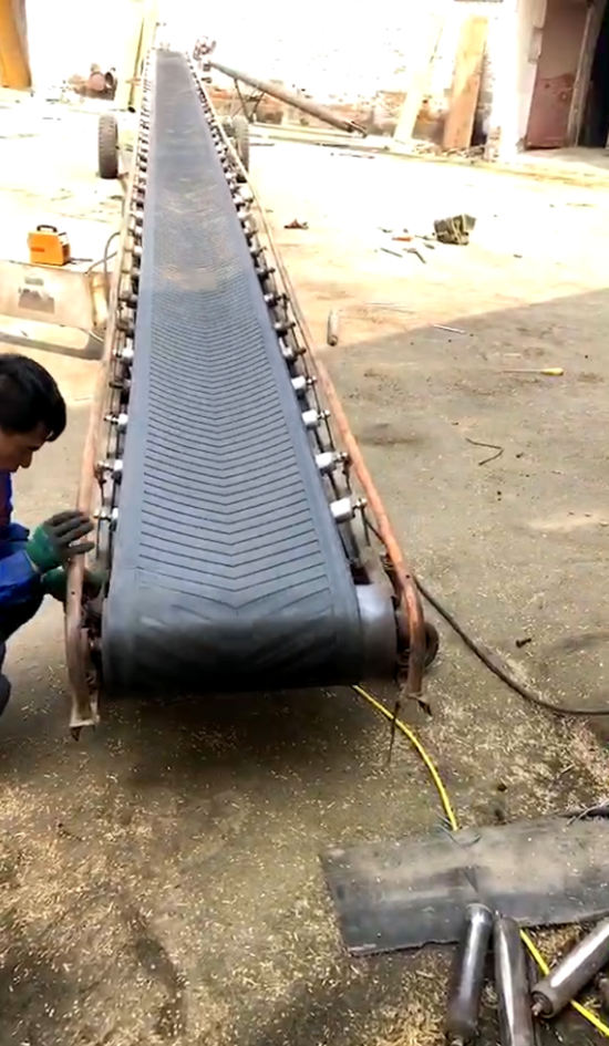 Engineers are debugging tensioning equipment for belt conveyors
